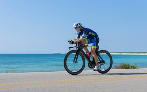 ironman cozumel female athlete on bike
