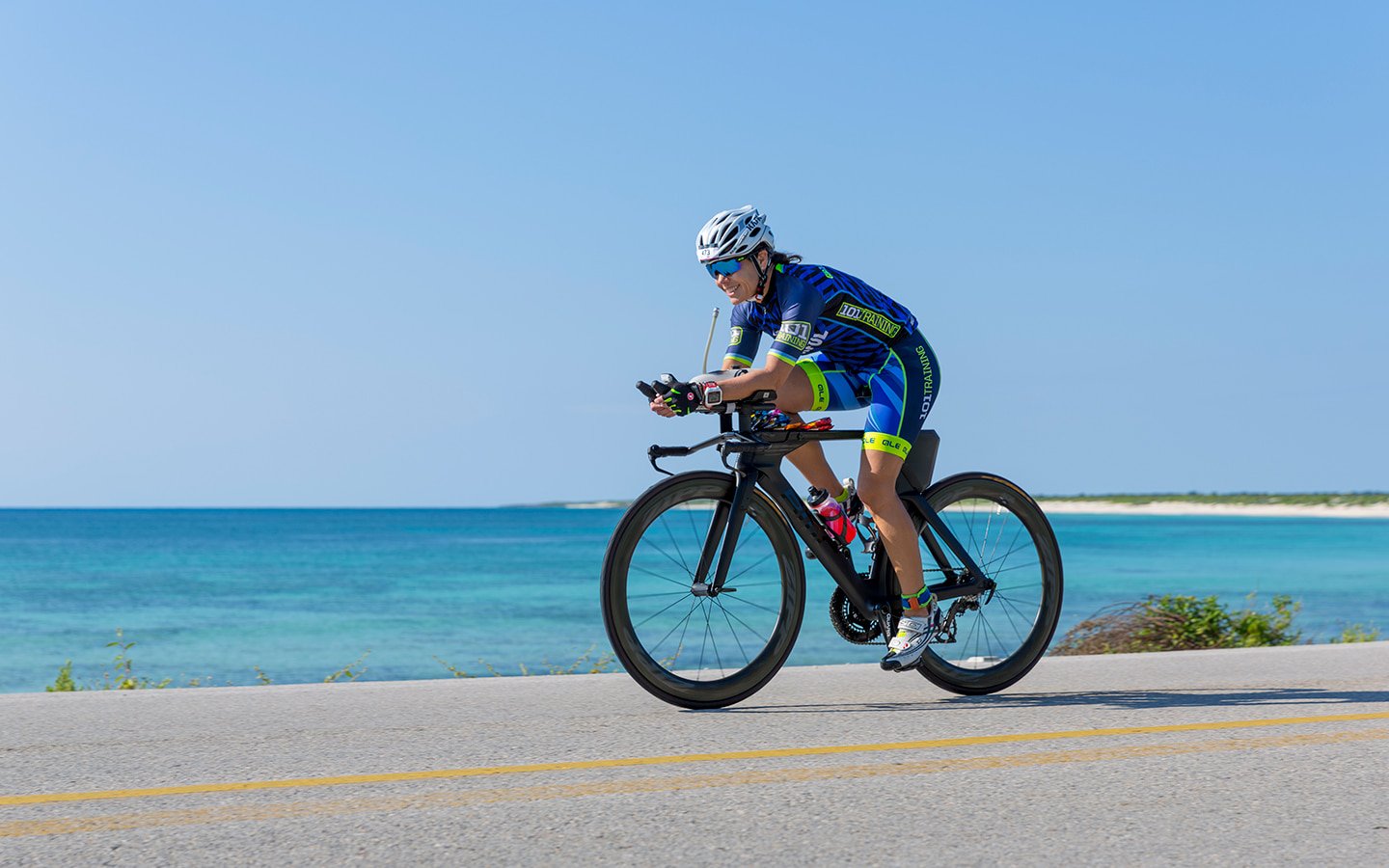 ironman cozumel female athlete on bike